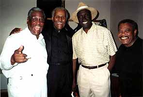 Arthur Lee Maye (hat) visits with Bobby, Waldo and Milton backstage